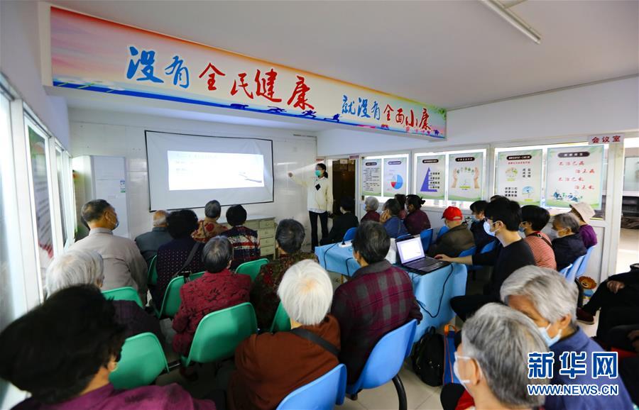 （新華全媒頭條·兩會精神看落實·圖文互動）（3）整體謀劃、系統(tǒng)升級、全面提升——落實全國兩會精神織牢織密公共衛(wèi)生防護網